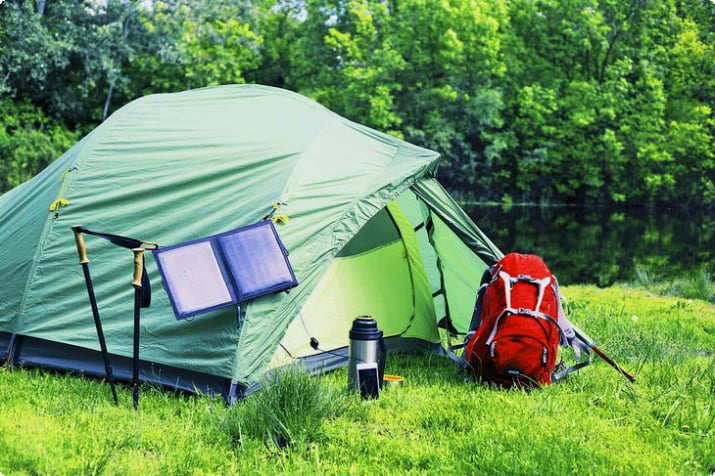 Tent with a solar panel to charge electronics