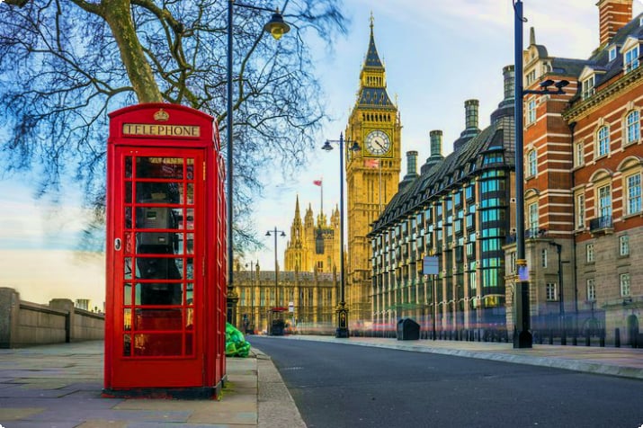 Iconic British red telephone box with Big Ben in the background